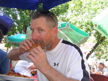 Ted trying the Cheeseburger in Paradise