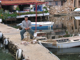 Hasan tending the nets